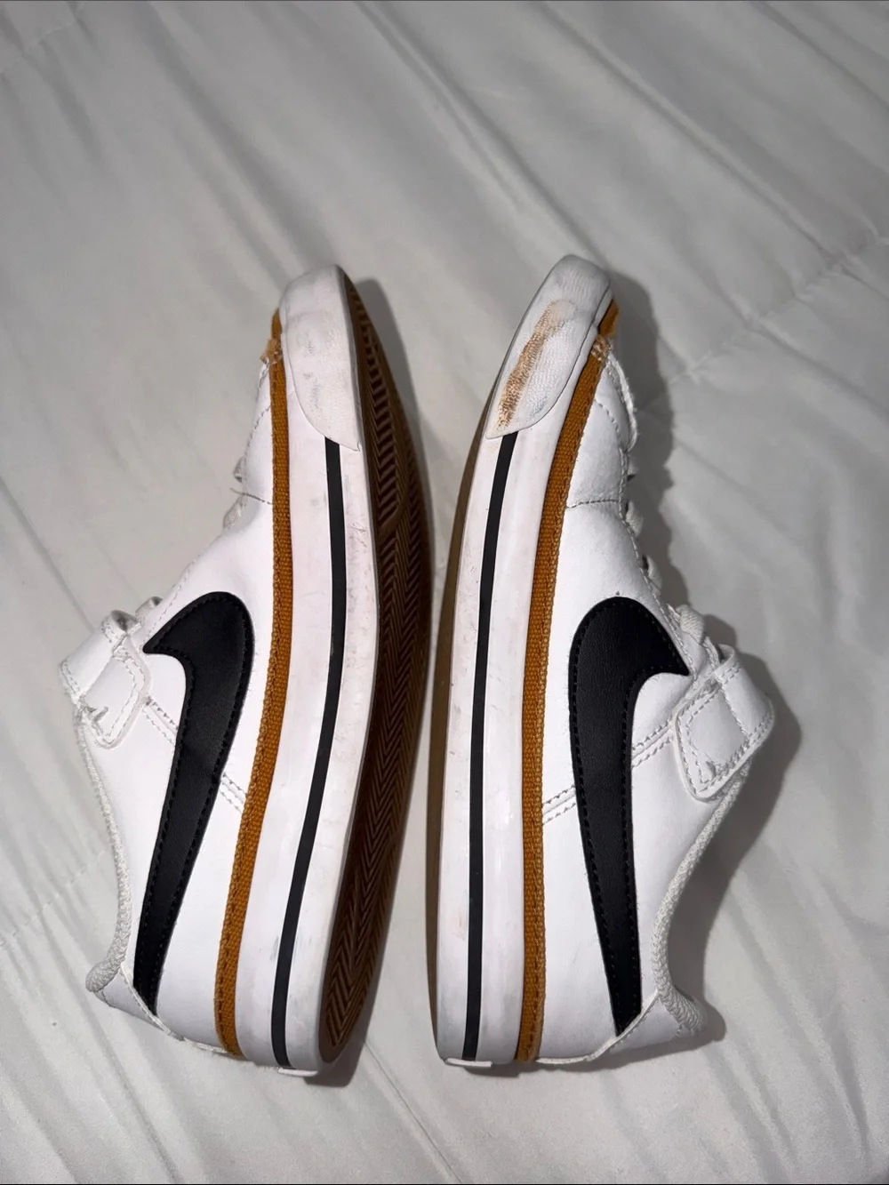 Nike White Kids Sneakers with Black Swoosh and Brown Trim
